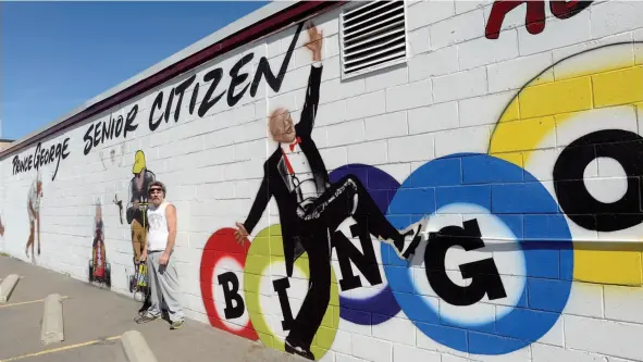  ?? CITIZEN PHOTO BY BRENT BRAATEN ?? Airbrush artist Greg Gislason stands by a mural he is creating at the Prince George Seniors Centre on Brunswick Street.