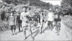  ??  ?? Photo taken on Sept 26 shows Efren “Tata” Balladares (third left), one of the leaders of the Palawan NGO Network Inc (PNNI), standing in front of other para-enforcers from the group on the outskirts of a forest near the tourist town of El Nido.