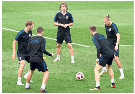  ?? — AFP ?? Hard at work: Croatia midfielder Luka Modric (centre) training with teammates at the Luzhniki Stadium on Saturday.