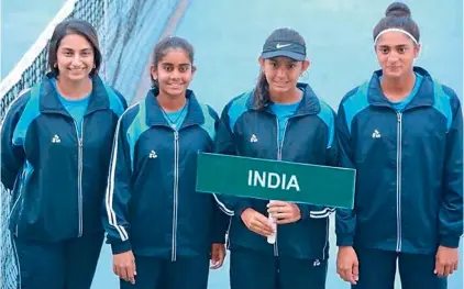  ??  ?? India U-16 girls tennis players (from left), captain Aarthi Natekar, Sai Dedeepya, Salsa Aher and Shaik Humera line up ahead of the Asia Oceania Junior Federation Cup being played at the DLTA Complex in New Delhi.