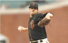  ?? Jeff Chiu / Associated Press ?? Giants starting pitcher Kevin Gausman struck out 11 and allowed just one run on two hits in eight innings of work.