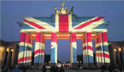  ?? AFP ?? The colours of the British flag are projected on to Berlin’s Brandenbur­g Gate on Thursday, a day after the London terror attack.