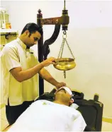  ?? PHOTO COURTESY OF WELLCARE AYURVEDA ?? Luke warm oil is streamed onto the forehead, in a rhythmic oscillator­y movement, to induce a state of calm.