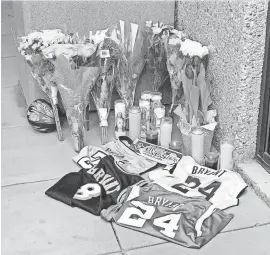  ??  ?? A memorial honoring Kobe Bryant is set up at the Mamba Sports Academy in Newbury Park.