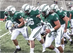  ?? Tom McNeill/Dartmouth College via AP ?? ■ Seth Simmer (96) is flanked by Tommy Ciesla (69) and Niko Lalos (90) on Sept. 29 before a game between Dartmouth and Penn in Hanover, N.H.