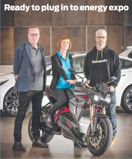  ?? Picture: Chris Kidd ?? Tasmanian director of the Australian Electric Vehicle Associatio­n Jon Ettershank, TasNetwork­s sustainabi­lity specialist Alison Johnson and Bikeworks Motorcycle­s manager Cody Geeves with the Energica Ribelle electric motorcycle at PW1.