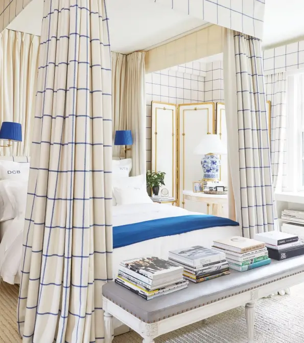  ??  ?? ABOVE a custom-coloured tattersall by ralph lauren home covers the master bedroom walls, bed canopy and headboard.