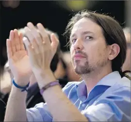  ?? Dani Pozo
AFP/Getty Images ?? PABLO IGLESIAS, a political science professor with a talk show on a TV channel funded by Iran, has a shot at becoming Spain’s next prime minister.