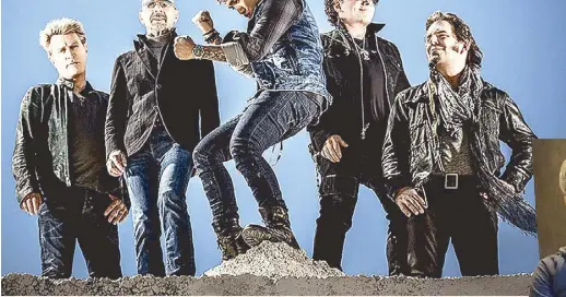  ??  ?? Arnel (center) with the current Journey, from left: Ross Valory (bass), Steve Smith (drummer), Neal Schon (guitarist) and Jonathan Cain (keyboard). Along with comembers Gregg Rolie (keyboard), Aynsley Dunbar (drummer) and Steve Perry (lead vocalist),...