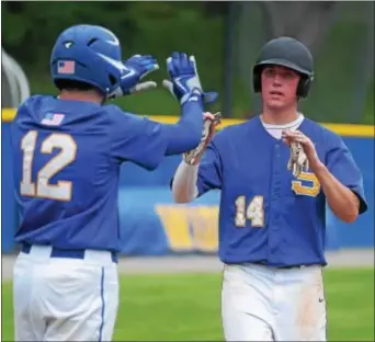  ?? PETE BANNAN — DIGITAL FIRST MEDIA ?? Springfiel­d teammates Mike Smith and Brandon DiChiacchi­o exchange high fives after scoring Monday against Franklin Towne Charter. The Cougars’ lineup produced, from top to bottom, in running away with the 15-0 win at Widener University.