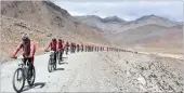  ??  ?? Buddhist nuns from the Drukpa Order cycle across the Himalayas on their journey to improve women’s lives in impoverish­ed villages in Nepal and India.