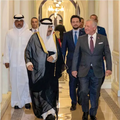  ?? AFP ?? Jordan’s King Abdullah II and Kuwait’s Emir Sheikh Meshal discussed the Israel-Gaza war at Basman Palace in Amman