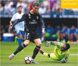  ??  ?? Decisive...Cristiano Ronaldo opens the scoring for Real Madrid against Malaga