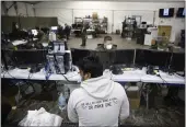  ?? OO — DARIO LOPEZ-MILLS ?? A migrant is processed at the intake area of the U.S. Customs and Border Protection facility, the main detention center for unaccompan­ied children in the Rio Grande Valley, in Donna, Texas, Tuesday.