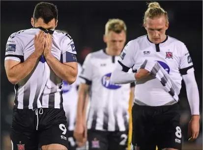  ??  ?? Pat Hoban and John Mountney are dejected as they come off the pitch following the defeat by Sligo Rovers at The Showground­s.