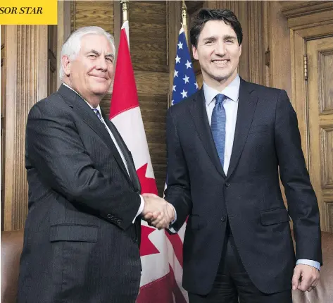  ?? ADRIAN WYLD/AFP/GETTY IMAGES ?? U.S. Secretary of State Rex Tillerson and Prime Minister Justin Trudeau meet on Parliament Hill Tuesday. Canada and the U.S. announced that they will host a summit of foreign ministers in Vancouver in mid-January to seek progress on the North Korean...