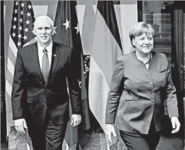  ?? JOHANNES SIMON/GETTY ?? Vice President Mike Pence met with German Chancellor Angela Merkel on Saturday.