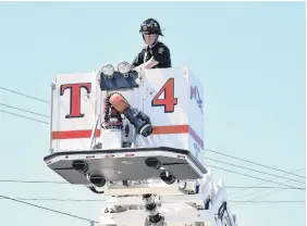  ?? FRAM DINSHAW/ TRURO NEWS ?? The Truro Fire Service deployed its crane truck in a demonstrat­ion at the Canada’s 911 Ride fundraiser in Truro on Saturday.