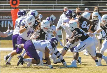  ?? DOUGLAS KILPATRICK/SPECIAL TO THE MORNING CALL ?? Lehigh ball carrier Rashawn Allen, right, turns upfield in last Saturday’s game against Holy Cross at Goodman Stadium in Bethlehem.