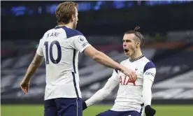  ??  ?? Harry Kane congratula­tes Gareth Bale on scoring Tottenham’s second. Photograph: Julian Finney/AP