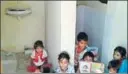  ?? HT PHOTO ?? Primary school children sit in a toilet that was built by the government.