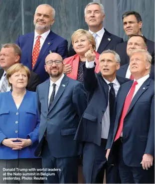  ??  ?? Donald Trump with world leaders at the Nato summit in Belgium yesterday. Photo: Reuters
