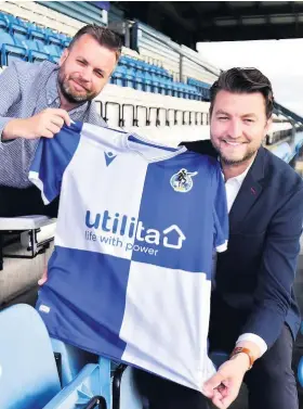  ?? PHOTO: DAN REGAN ?? Dan Lovering and Rovers commercial director Tom Gorrige with the new Rovers shirt at the Memorial Stadium