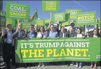  ?? AP FILE ?? Germany’s Green Party protests against Donald Trump's decision to exit the Paris agreement.