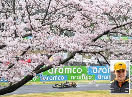  ?? ?? Scenic: Mclaren’s australian driver Oscar piastri (above and inset) drives past cherry blossom trees during the second practice session for the Japan Grand prix at the Suzuka.