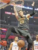 ?? MARK J. TERRILL/ASSOCIATED PRESS ?? Atlanta’s Alex Len, dunking last month, is averaging a career-high 10.2 points and 5.7 rebounds in a little over 19 minutes a game.