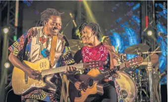  ??  ?? Cameroonia­n artist Kareyce Fotso, right, performs at the Harare Internatio­nal Festival of the Arts in Zimbabwe.