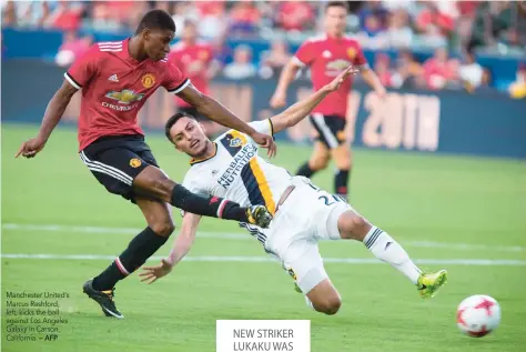  ?? — AFP ?? Manchester United’s Marcus Rashford, left, kicks the ball against Los Angeles Galaxy in Carson, California.