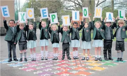  ??  ?? ●●Cheadle Hulme Reception pupils celebrate their good marks