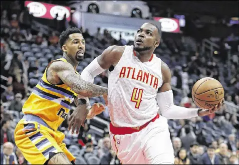  ?? PHOTOS BY JOHN BAZEMORE / ASSOCIATED PRESS ?? Forward Paul Millsap believes energy and mindset are the keys to ending the Hawks’ propensity for blowout losses. They’ve lost four games by 25 points or more this season.