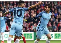  ??  ?? SILVA LINING: Aguero hails the Spaniard for scoring opener