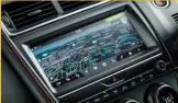 ??  ?? BACHELOR PAD. The huge touch screen and the fine stitching in the upholstery is luxurious, but it’s the wraparound dashboard that’ll impress the most. Easter eggs like a jaguar mom and her cub in the obscuratio­n band of the windshield are a delightful...