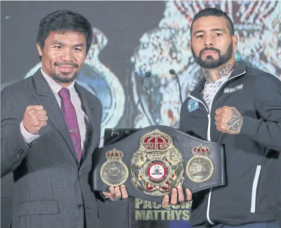  ??  ?? Manny Pacquiao, left, and Lucas Matthysse pose at a press conference in Kuala Lumpur.