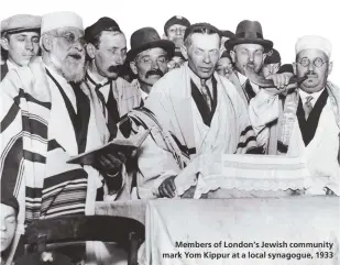  ??  ?? Members of London’s Jewish community mark Yom Kippur at a local synagogue, 1933