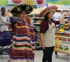  ?? VIVIAN ZINK/NBC ?? Nico Santos as Mateo and America Ferrera as Amy in Superstore.