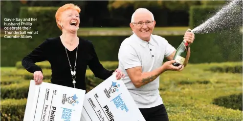  ??  ?? Gayle Say and her husband Phillip celebrate their Thunderbal­l win at Coombe Abbey