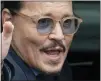  ?? THE ASSOCIATED PRESS ?? Legal and entertainm­ent experts said Amber Heard’s and Johnny Depp’s reputation­s have been damaged by ugly details about their brief marriage that came out during the televised trial watched by millions.