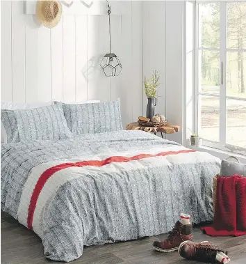  ?? SIMONS ?? Classic Canadian woollen work socks were the inspiratio­n for the realistic photo print used in the Simons bedding shown here. In addition to the duvet set, the Quebec-based department store’s Wool-Sock Stripe line also includes a ribbed knitted throw...