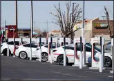  ?? LAUREN JUSTICE / THE NEW YORK TIMES ?? Electric vehicles charge March 11 in Victorvill­e, Calif. In California, electric vehicles could soon account for 10% of peak power demand.