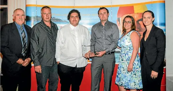  ??  ?? Far North Surf Rescue of the Year team. From left Dave Ross, Anthony Walker, Tony Walker, Thom Anderson and Kate Clarke with BP’s Haley Mahoney.