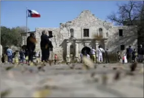  ?? ERIC GAY — THE ASSOCIATED PRESS FILE ?? In this file photo, guests visit the grounds of the Alamo in San Antonio. Texas Land Commission­er George P. Bush is overseeing a 7-year, $450million revamp of the Alamo, where 189indepen­dence fighters were killed in 1836. That includes restoratio­n of...