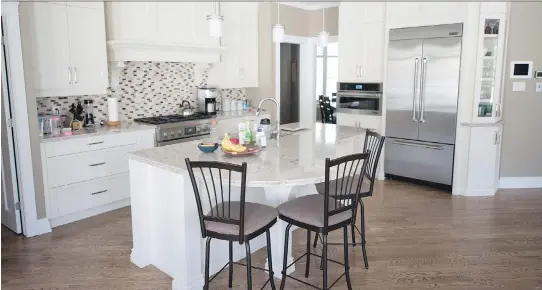  ?? PHOTOS: MATHIEU LEGAULT ?? The spacious kitchen in lot 19. Building custom homes takes a little longer, notes Luc Legault, “but it’s very rewarding.”