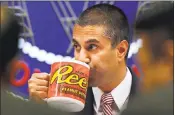  ?? JACQUELYN MARTIN — THE ASSOCIATED PRESS FILE ?? A Burger King commercial explaining net neutrality takes a dig at Ajit Pai, head of the Federal Communicat­ions Commission, by featuring an oversized coffee mug.