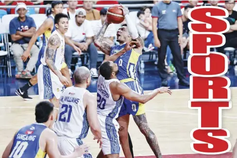  ?? ?? Magnolia Chicken Timplados Hotshots’ Tyler Bey goes for a tough shot against TNT Tropang Giga’s Rahlir Hollis-Jefferson.