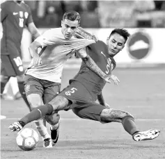  ??  ?? Brazil’s Philippe Coutinho (L) and Chile’s Erick Pulgar vie for the ball during their FIFA 2018 World Cup qualifier football match in Sao Paulo, Brazil, on October 10, 2017.- AFP photo