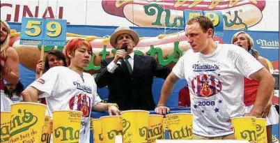  ?? ESPN Films ?? Takeru Kobayashi, left, and Joey Chestnut at the 2008 Nathan's Famous Hot Dog Eating Contest.